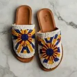 Leonardo Kino XL Topdown flat lay of handbeaded Nigerian leath 0